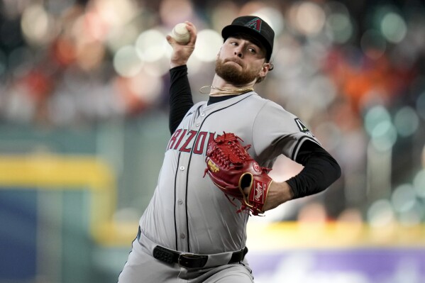 Arizona Diamondbacks starting pitcher Ryne Nelson throws against the Houston Astros during the first inning of a baseball game, Sunday, Sept. 8, 2024, in Houston. (AP Photo/Eric Christian Smith)