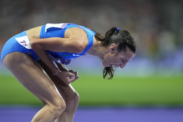 Nadia Battocletti, of Italy, reacts after winning the silver medal in the women's 10000 meters final at the 2024 Summer Olympics, Friday, Aug. 9, 2024, in Saint-Denis, France. (AP Photo/Ashley Landis)