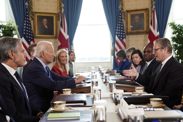 Britain's Prime Minister Keir Starmer, right, and Foreign Secretary David Lammy, second right, during a meeting with US President Joe Biden, centre left, in the Blue Room at the White House in Washington, Friday Sept. 13, 2024. (Stefan Rousseau/Pool via AP)