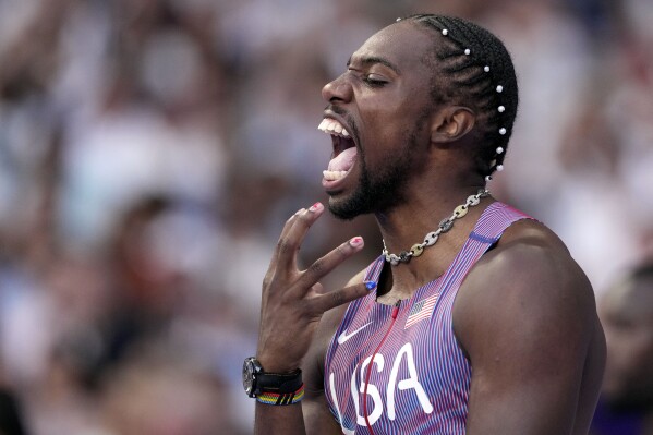 Noah Lyles, of the United States, reacts ahead of his men's 100-meters semifinal at the 2024 Summer Olympics, Sunday, Aug. 4, 2024, in Saint-Denis, France. (AP Photo/Bernat Armangue)