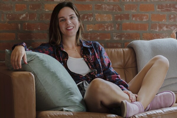 Kendra King sits on her sofa in her home in Philadelphia on July 26, 2024. (Deena J. Leh via AP)