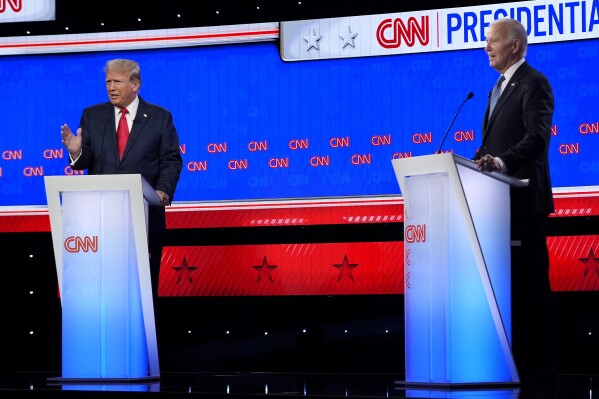 FILE - President Joe Biden, right, and Republican presidential candidate former President Donald Trump, left, during a presidential debate June 27, 2024, in Atlanta. (AP Photo/Gerald Herbert, File)