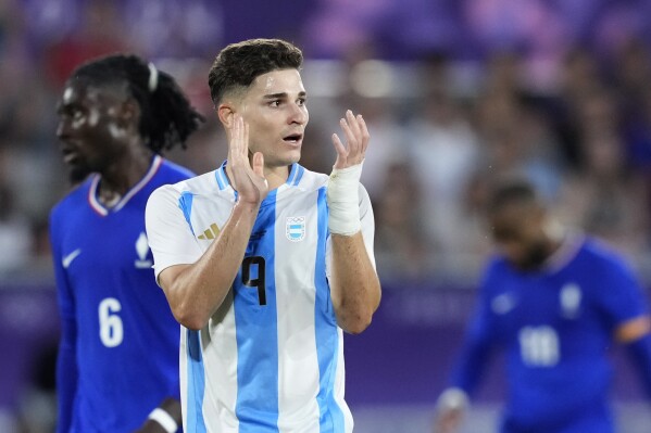 Argentina's Julian Alvarez reacts during a quarter final soccer match between France and Argentina, at Bordeaux Stadium, during the 2024 Summer Olympics, Friday, Aug. 2, 2024, in Bordeaux, France. (AP Photo/Moises Castillo)