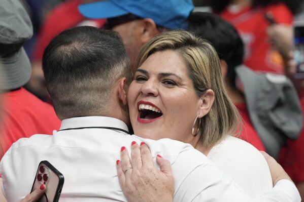 Former state lawmaker Raquel Teran hugs a supporter as she attends a campaign event Friday, Aug. 9, 2024, in Glendale, Ariz. (AP Photo/Ross D. Franklin)