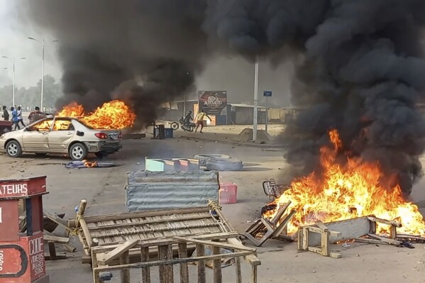 FILE - Anti-government demonstrators set a barricade on fire during clashes in N'Djamena, Chad, on Oct. 20, 2022. (AP Photo, File)