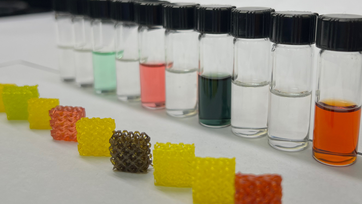 3D structures appear in front of vials containing substances constructed with those structures.