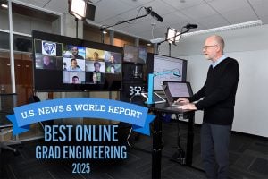 A professor teaching a remote class in a studio.