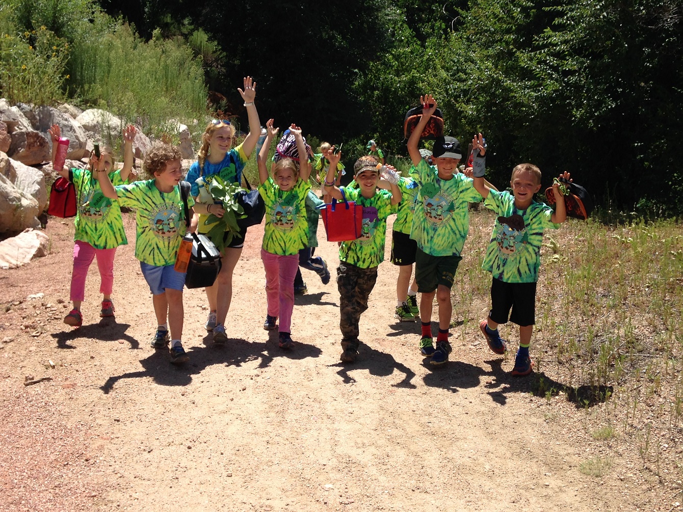 Nature campers walking down a trail