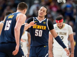 Denver Nuggets forward Aaron Gordon, right, is congratulated after scoring a basket by center Nikola Jokic