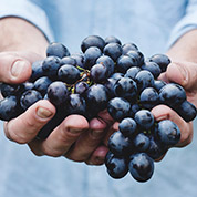 man holding grapes