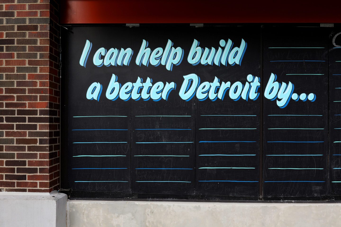 A mural that reads, 'I Can Help Build A Better Detroit By...'