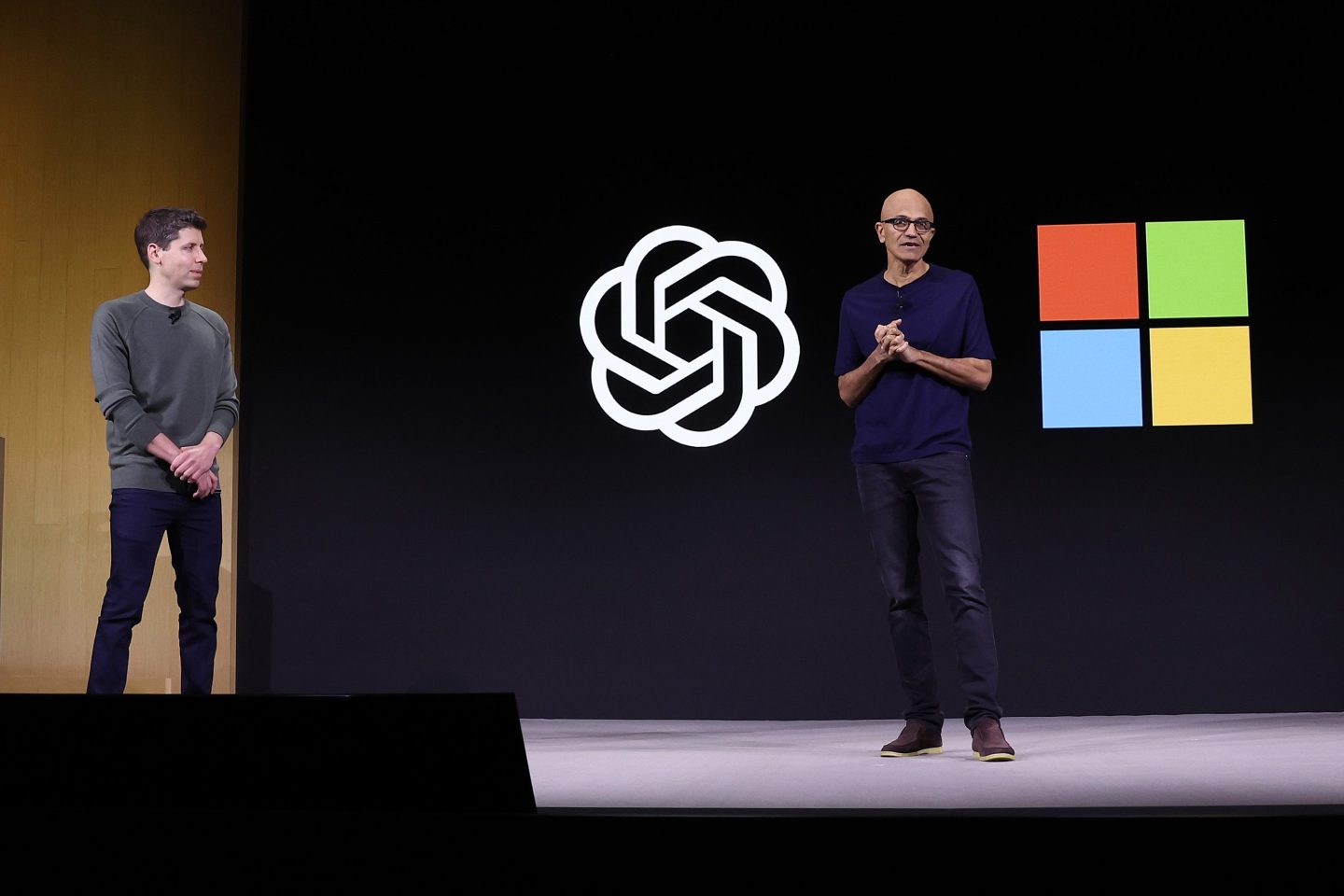 Satya Nadella (R) speaks as OpenAI CEO Sam Altman (L) looks on during the OpenAI DevDay event on November 06, 2023 in San Francisco, California. Altman delivered the keynote address at the first ever Open AI DevDay conference.