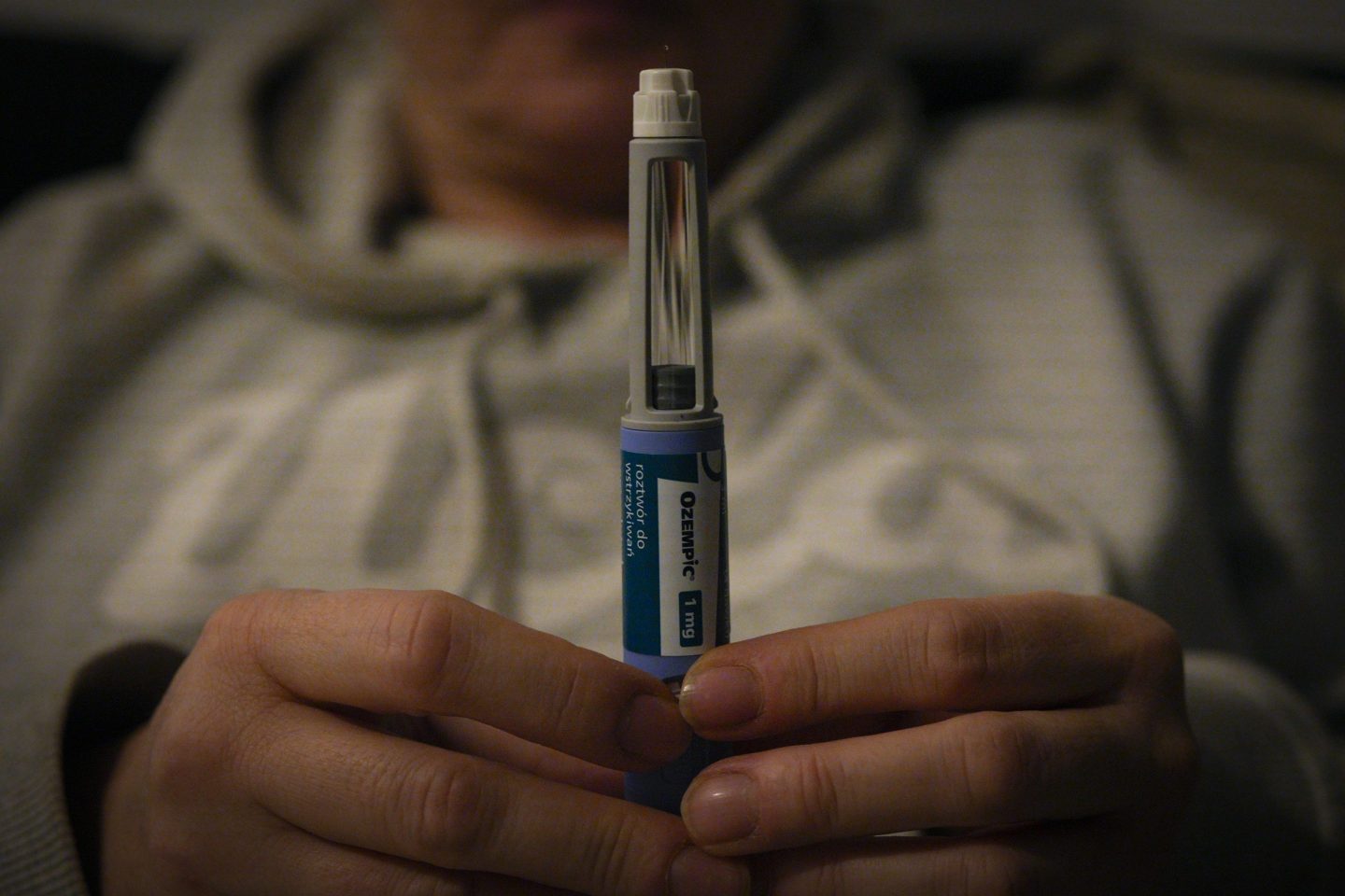 A woman holds an Ozempic needle shot pen in this photograph taken in Warsaw, Poland on 19 November, 2023. German regulator BfArM is considering banning the export of the Ozempic weight loss drug, manufactured by the Danish Novo Nordisk company due to shortages caused by popularity in the United States. Ozempic is commonly prescribed to patience with diabetes or a risk or getting diabetes however Ozempic is also effective as a stand alone weight loss solution. (Photo by Jaap Arriens/NurPhoto via Getty Images)