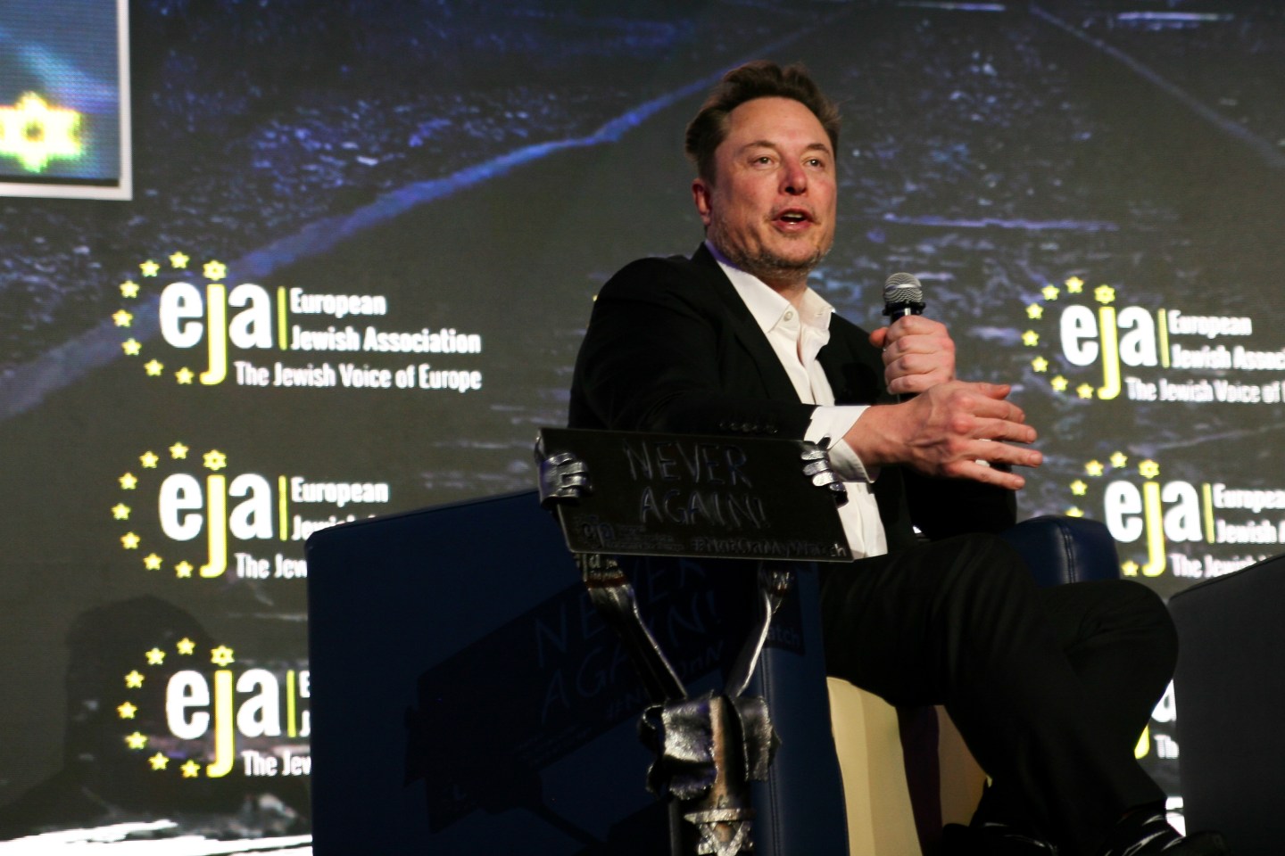 Elon Musk, CEO of Tesla and owner of X (formerly Twitter), is engaging in a conversation