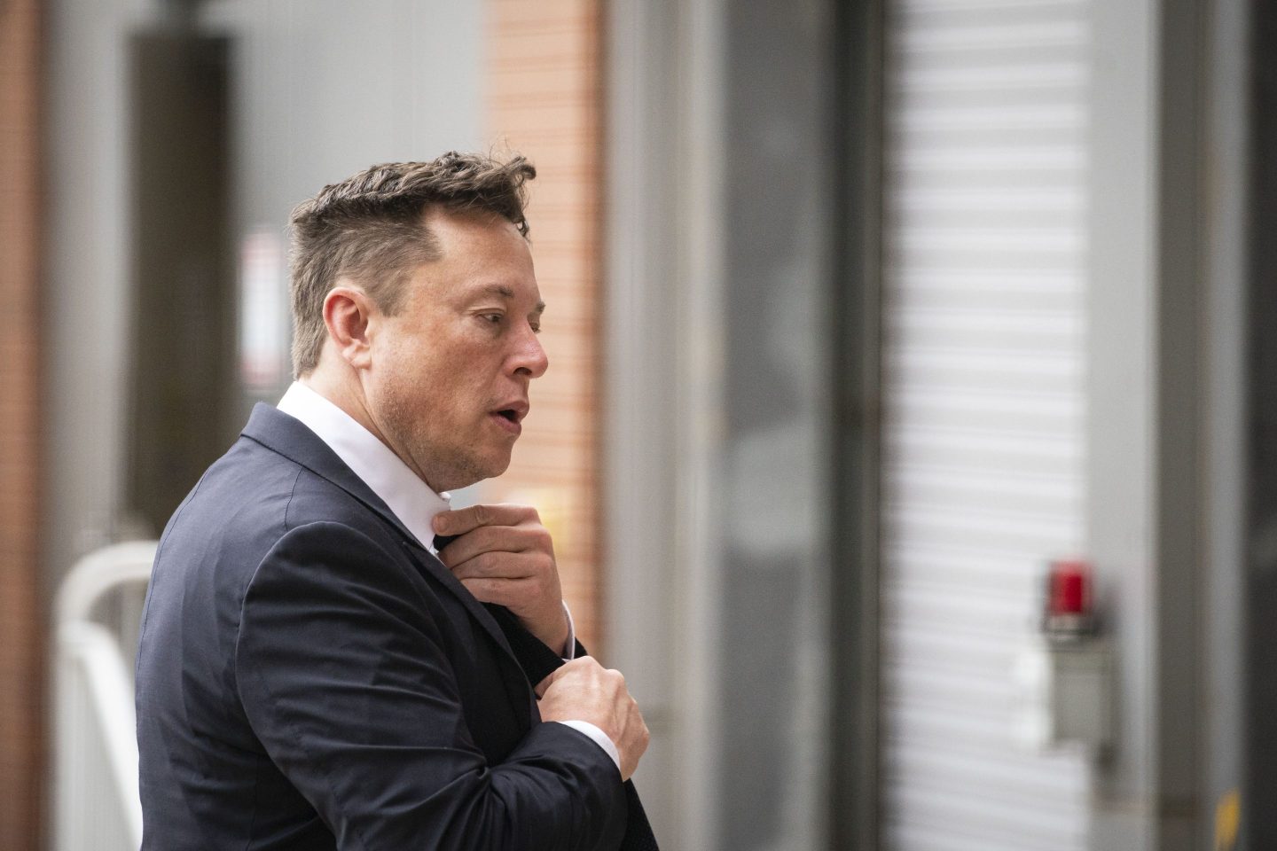 Elon Musk, chief executive officer of Tesla Inc., arrives at court during the SolarCity trial in Wilmington, Delaware, U.S., on Tuesday, July 13, 2021. Musk was cool but combative as he testified in a Delaware courtroom that Tesla&#8217;s more than $2 billion acquisition of SolarCity in 2016 wasn&#8217;t a bailout of the struggling solar provider. Photographer: Al Drago/Bloomberg via Getty Images