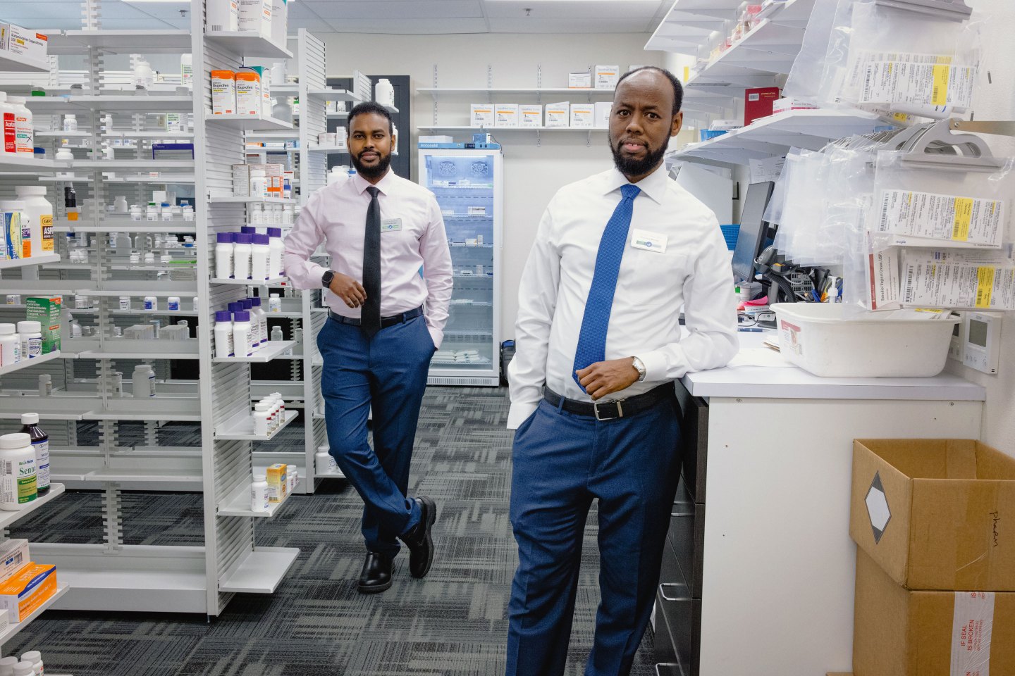 Ahmed Ali and Abdi Athur at Tukwila Station Pharmacy in Tukwila, Wash.