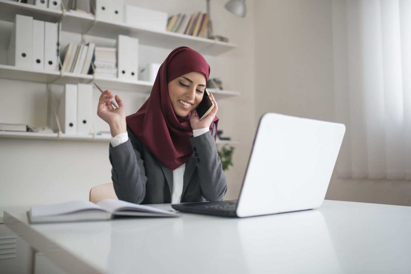 A businesswoman working at her office.