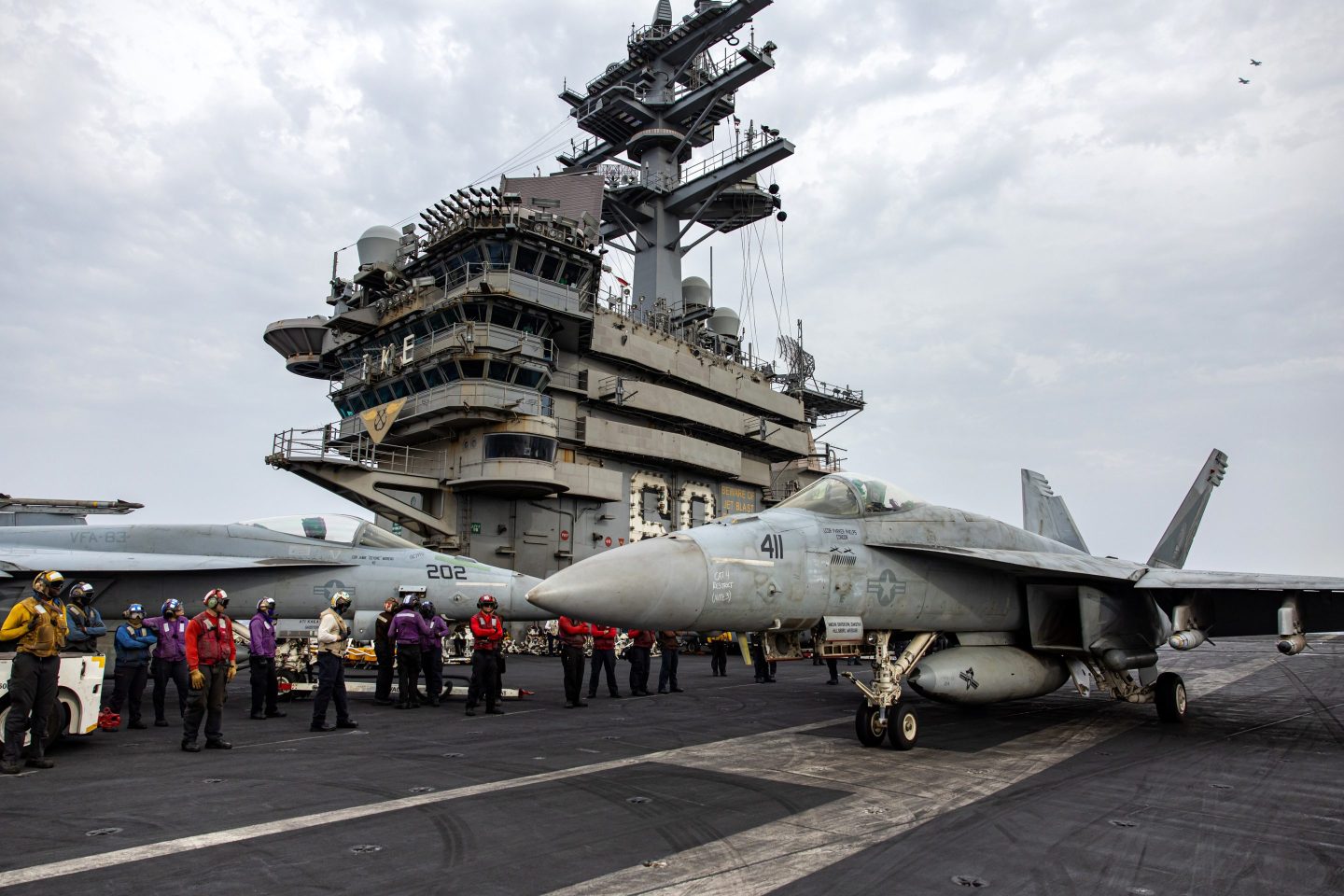 jets on deck of aircraft carrier