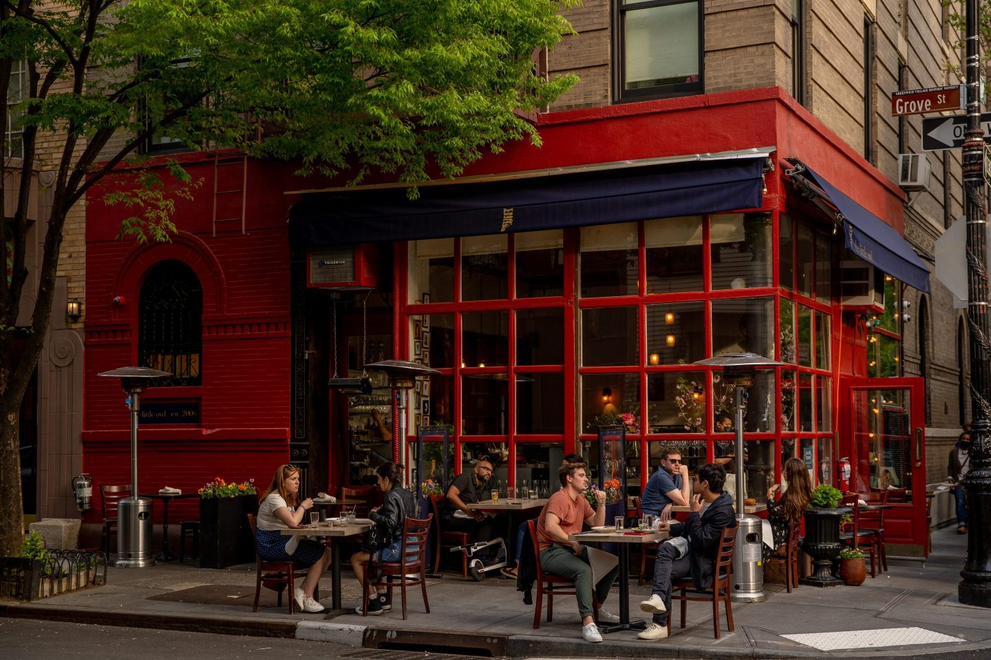 Customers sit in the outdoor dining area of a restaurant in the West Village neighborhood of New York, U.S., on Wednesday, April 28, 2021. Manhattan&#8217;s restaurants are struggling with a labor shortage that threatens to hobble the industrys comeback just as its getting started. Photographer: Amir Hamja/Bloomberg via Getty Images