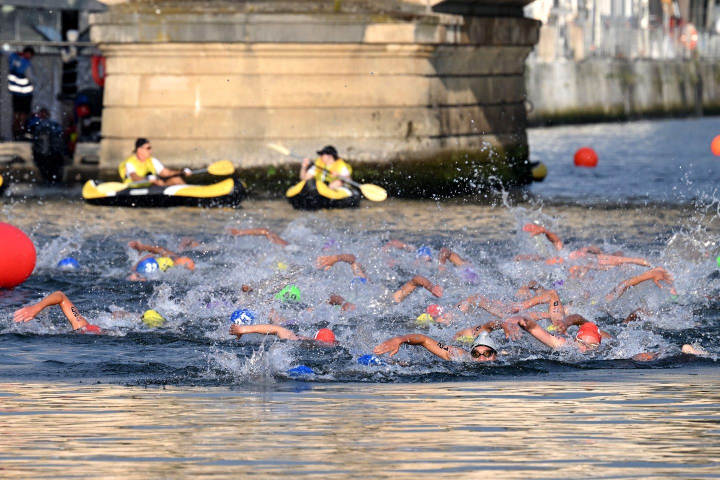 people swimming in the Seine River