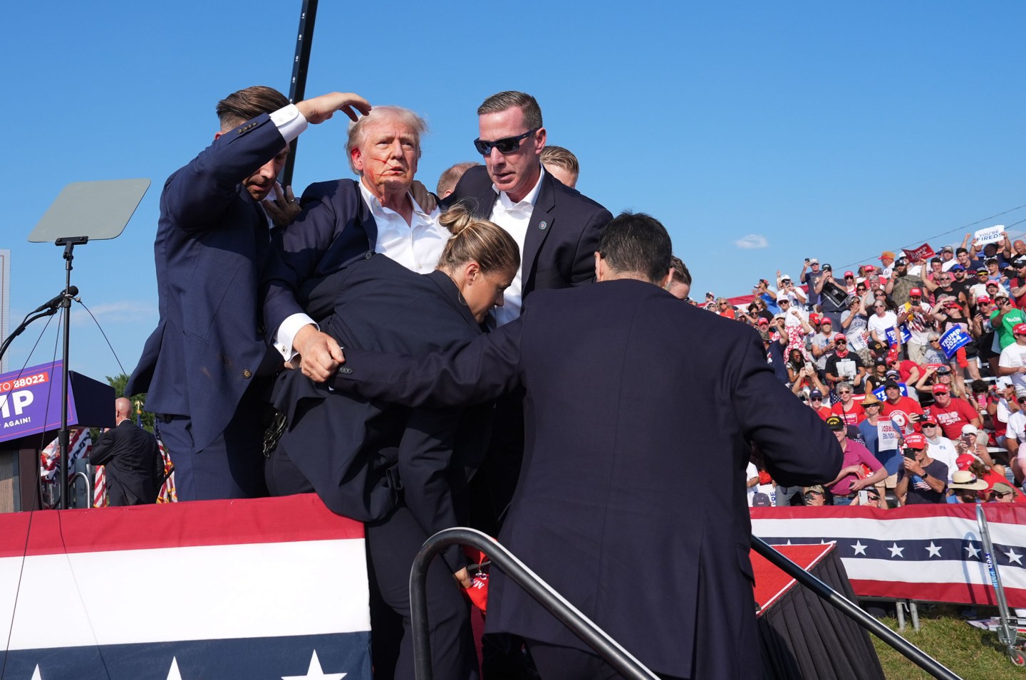 BUTLER, PENNSYLVANIA &#8211; July 13: Former president Donald Trump is assisted offstage during a campaign rally for former President Donald Trump at Butler Farm Show Inc. on Saturday, July 13, 2024 in Butler, Pa. Trump ducked and was taken offstage after loud noises were heard after he began speaking.<br />
(Photo by Jabin Botsford/The Washington Post via Getty Images)