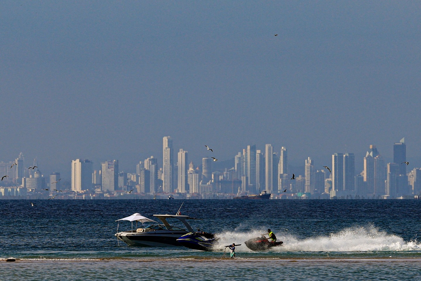 Tourists bathe in the beach at Taboga island in Panama City, on March 30, 2024.