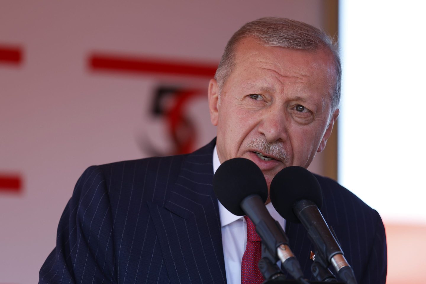 NICOSIA, CYPRUS - JULY 20: Turkish President Recep Tayyip Erdogan speaks during celebrations marking the 50th anniversary of Turkey's invasion of Cyprus on July 20, 2024 in occupied northern Nicosia, Cyprus. Fifty years has passed since Turkey's invasion and occupation of northern Cyprus, spurred in 1974 by Greece's attempts to oust the Cypriot president and forge a political union with the island. Over time, the northern part became the Turkish Republic of Northern Cyprus (TRNC), which is largely populated by ethnic Turks and recognized only by Turkey. To the south, the Republic of Cyprus is largely populated by ethnic Greeks and is an EU member state. (Photo by Alexis Mitas/Getty Images)