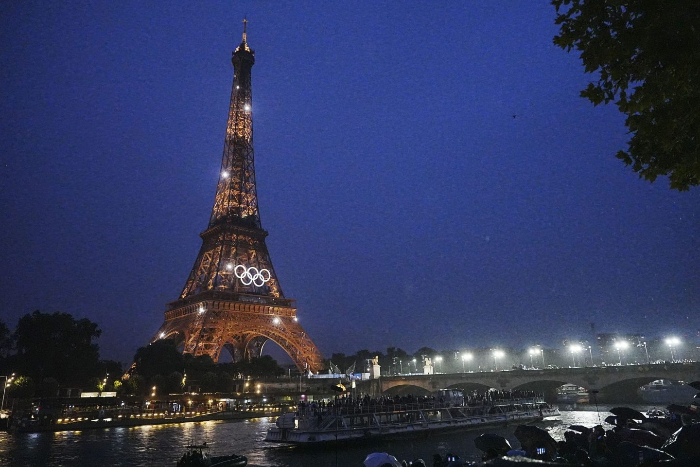 PARIS, FRANCE - JULY 26: Lights illuminate the Eiffel Tower during the opening ceremony of the Paris 2024 Olympic Games on July 26, 2024 in Paris, France. (Photo by Bai Yu/CHINASPORTS/VCG via Getty Images)