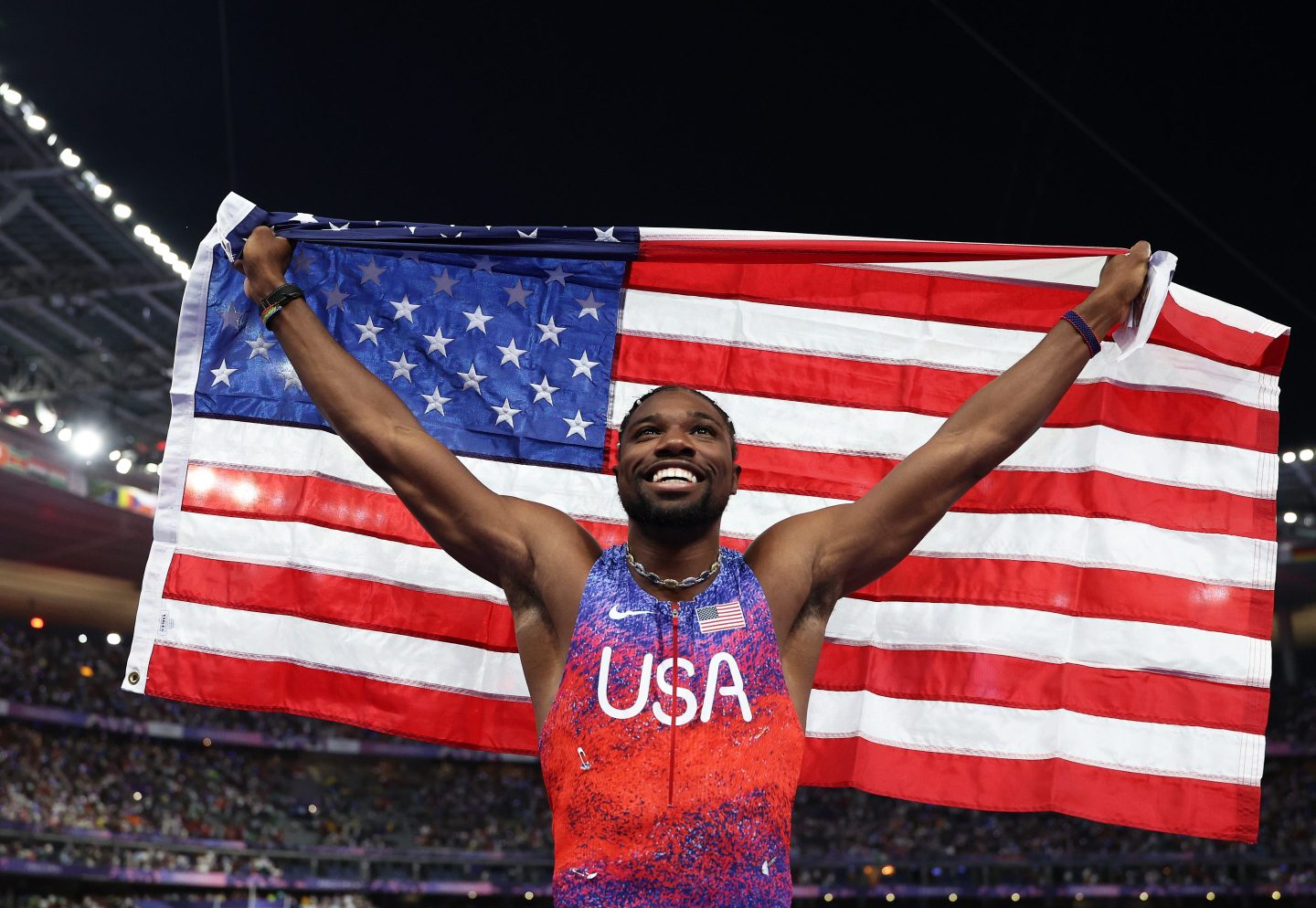 PARIS, FRANCE - AUGUST 04: Noah Lyles of Team United States celebrates winning the gold medal after competing the Men&#039;s 100m Final on day nine of the Olympic Games Paris 2024 at Stade de France on August 04, 2024 in Paris, France. (Photo by Christian Petersen/Getty Images)