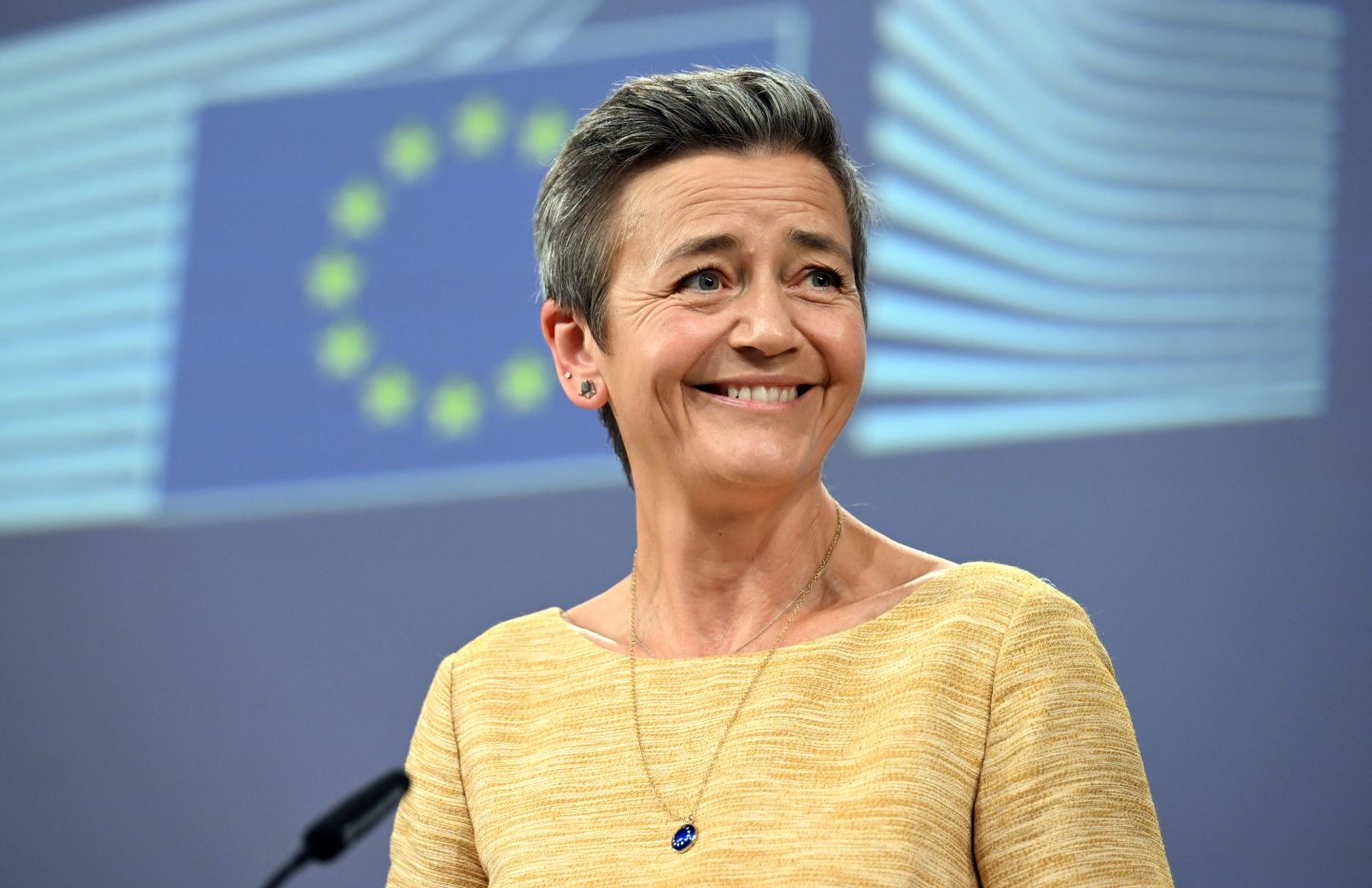 EU antitrust chief Margrethe Vestager looking very happy after winning Apple and Google cases