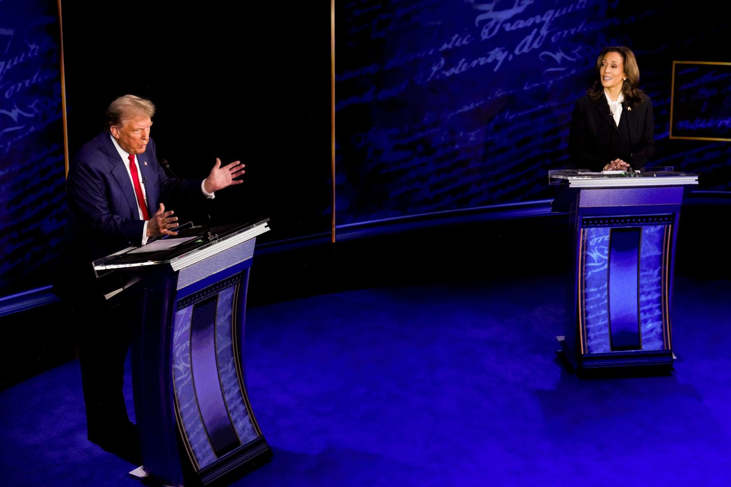 Donald Trump and Kamala Harris onstage in front of lecterns