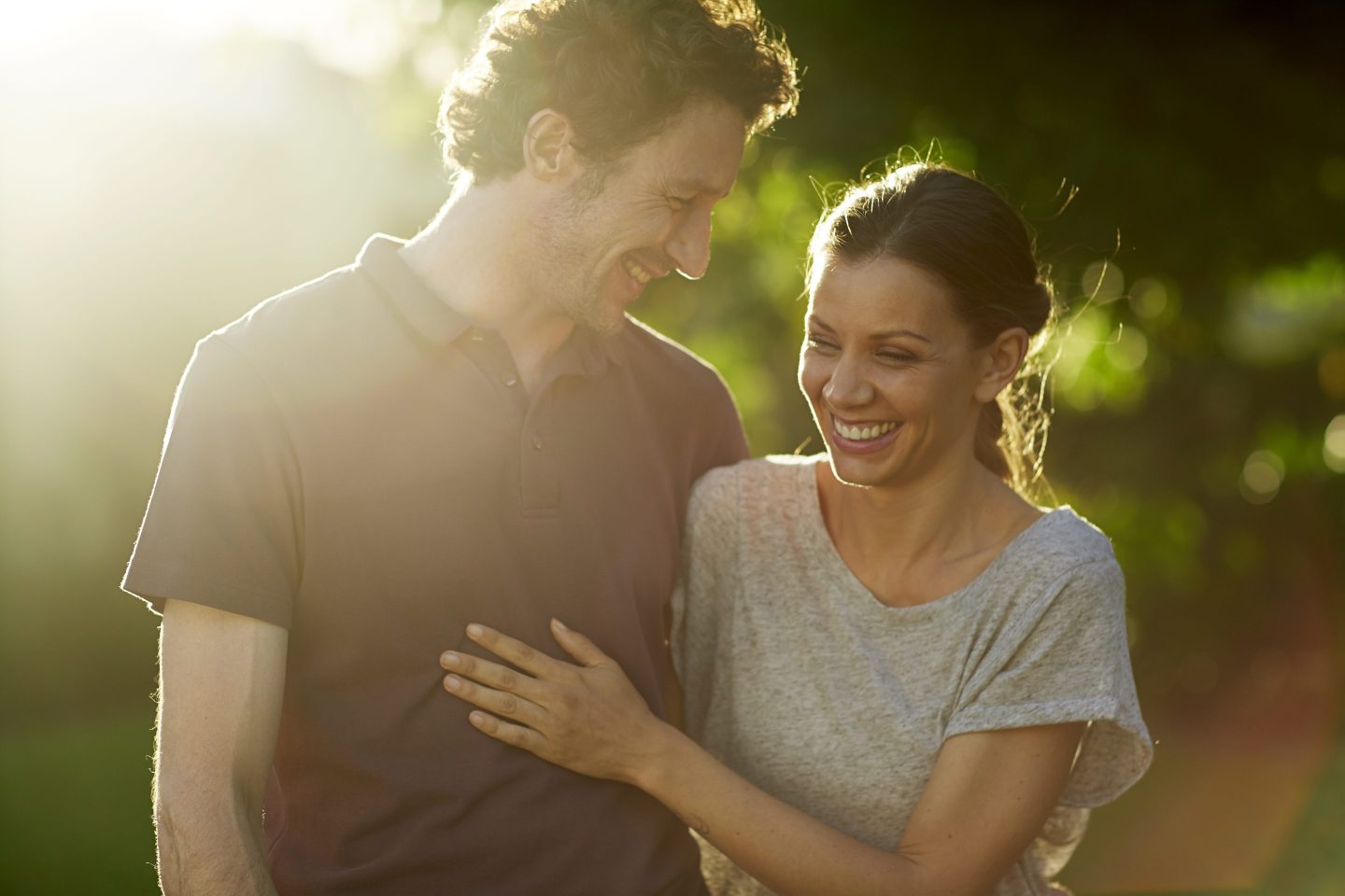 Happy couple together in a park