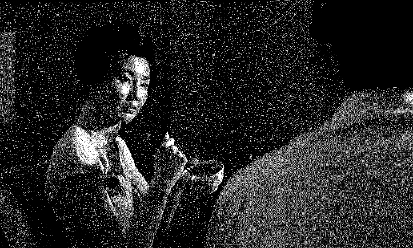 A black and white dithered still image from the movie 'In the Mood for Love'