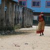 Older women, in particular, face additional challenges and prejudice due to ageist attitudes and discrimination. Pictured here, a 69-year-old woman walks in a village in Nepal.