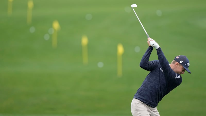 Ben Carr works out on the range during a practice for the Masters golf tournament at Augusta...