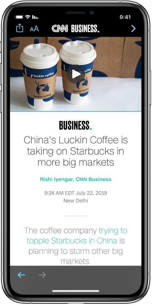 מאמר מ-Apple News. בפינה הימנית העליונה של המסך מופיע הכפתור ״הקודם״ לחזרה אל היישום ״מניות״. בפינה השמאלית העליונה של המסך מופיעים הכפתורים ״עיצוב מלל״ ו״שיתוף״. בפינה השמאלית התחתונה מופיע הכפתור ״העמוד הבא״.