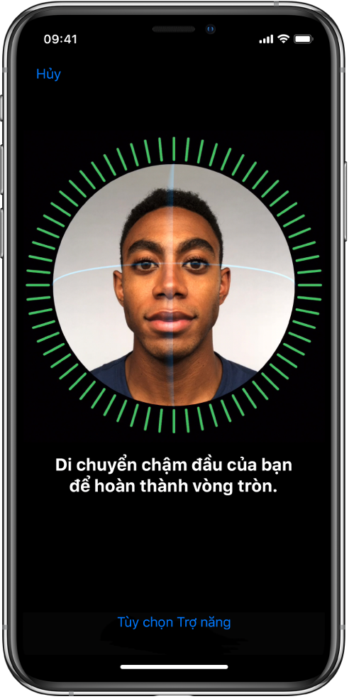 Màn hình thiết lập nhận dạng Face ID. Một khuôn mặt đang hiển thị trên màn hình, được bao trong một hình tròn. Văn bản bên dưới hướng dẫn bạn di chuyển chậm đầu để hoàn thành vòng tròn.