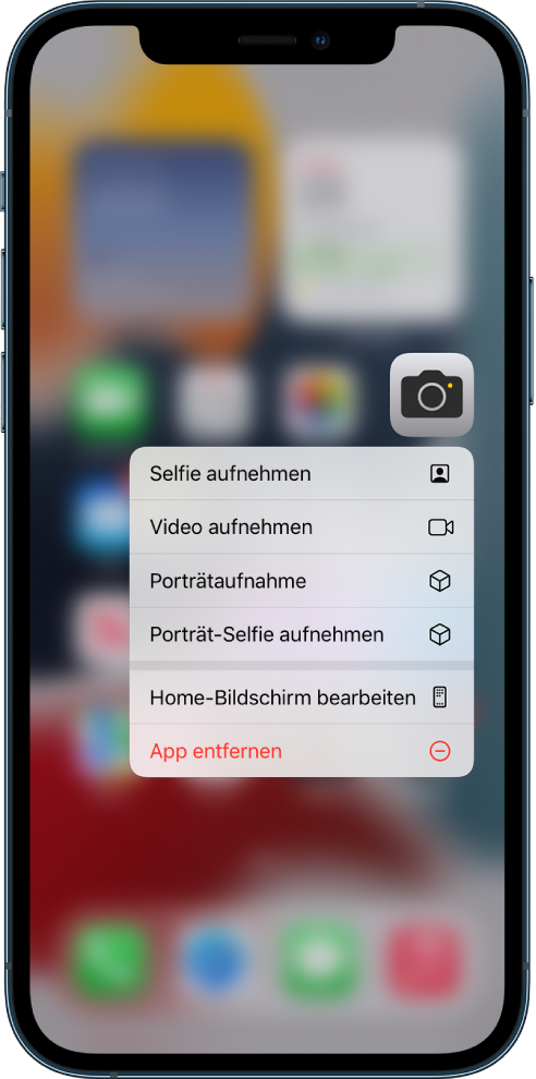 Im Hintergrund befindet sich der weichgezeichnete Home-Bildschirm mit dem Menü für Kamera-Schnellaktionen unter der App „Kamera“.