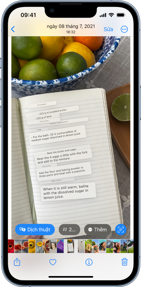 Một ảnh được mở ở chế độ toàn màn hình. Bên trong ảnh là văn bản được dịch. Ở cuối màn hình là các nút để dịch, chuyển đổi tiền tệ, v.v. Nút Dịch được chọn.