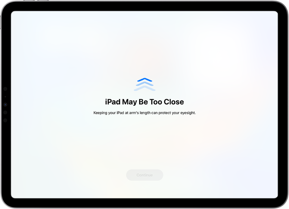 A screen warning that you’re holding the iPad too close and that you should move it farther away to protect your vision health. The warning covers the screen, stopping you from continuing. There’s a Continue button that becomes active when you’ve moved your iPad a safe distance away.