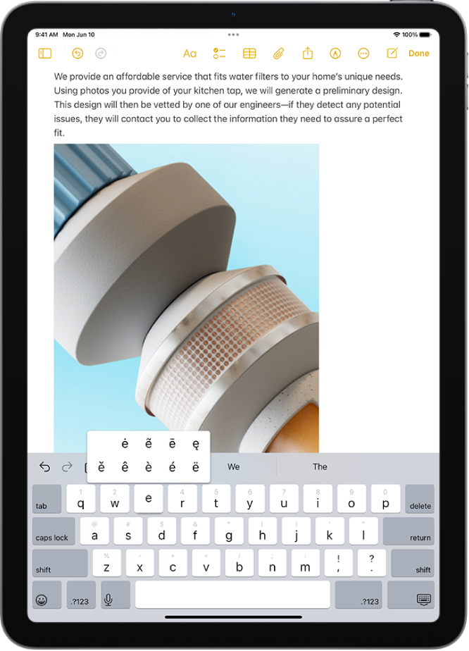 Ekrāna tastatūrā ir redzamas alternatīvas izceltās rakstzīmes, kas parādās, kad turat nospiestu E taustiņu.