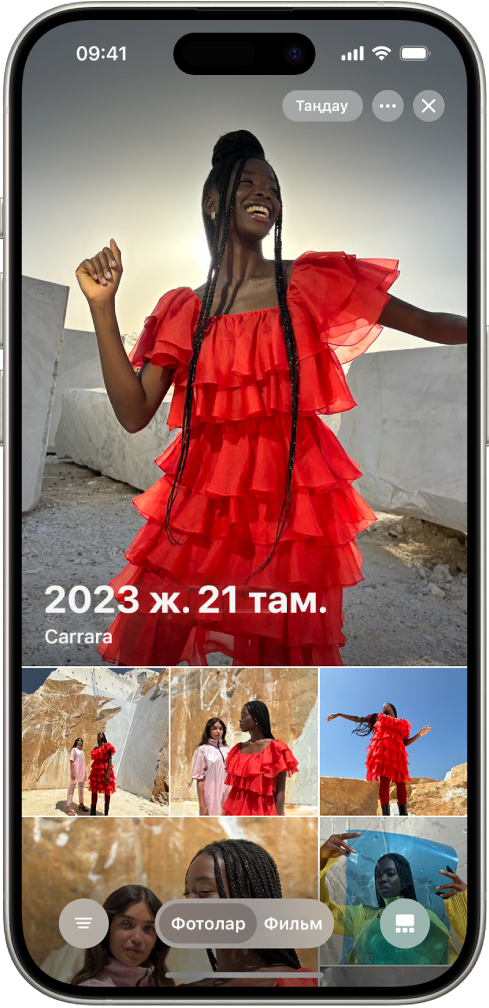 Белгілі бір күні түсірілген фотолар жинағын көрсетіп тұрған «Фотолар» қолданбасы.