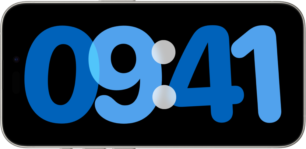 iPhone v stanju pripravljenosti, polni in stoji ob strani, na zaslonu pa je prikazana digitalna ura.