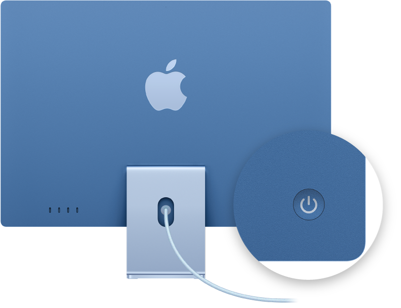 منظر خلفي لـ iMac مقاس 24 بوصة يركز بوضوح على زر الطاقة.