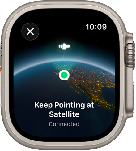 Ein Bildschirm zeigt ein Satellitensymbol über einer gewölbten Ansicht der Erde, einen grünen Verbindungsindikator und den Text „Weiterhin auf Satelliten richten“.