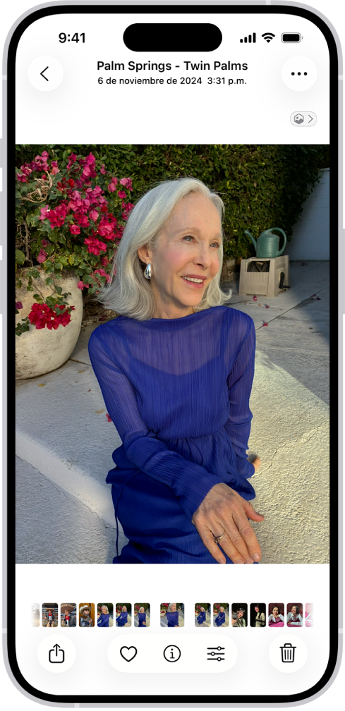 Una foto abierta con miniaturas de otras fotos en la parte inferior de la pantalla. En la parte superior izquierda está el botón Atrás que permite regresar a explorar.