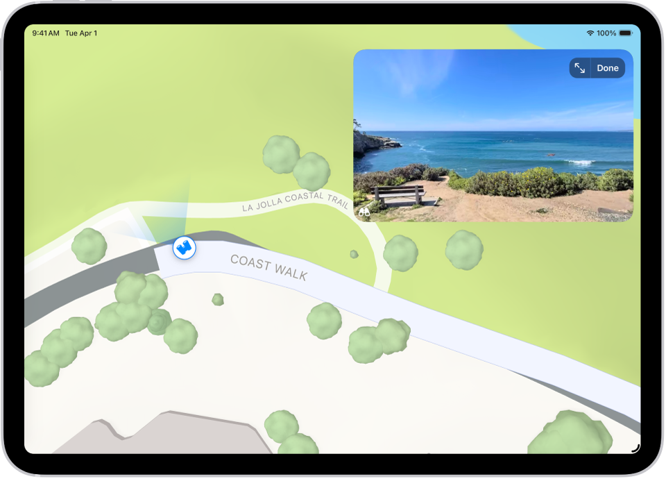 Una vista panoramica a 360° orientabile viene visualizzata sopra la mappa della zona contrassegnata nell’app Mappe. L’icona di “Guardati intorno” sovrapposta alla mappa punta in direzione della vista.