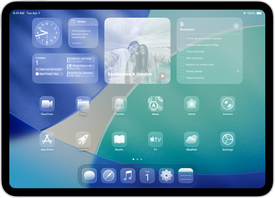 Ecranul principal al iPad‑ului cu pictogramele translucide ale aplicațiilor.
