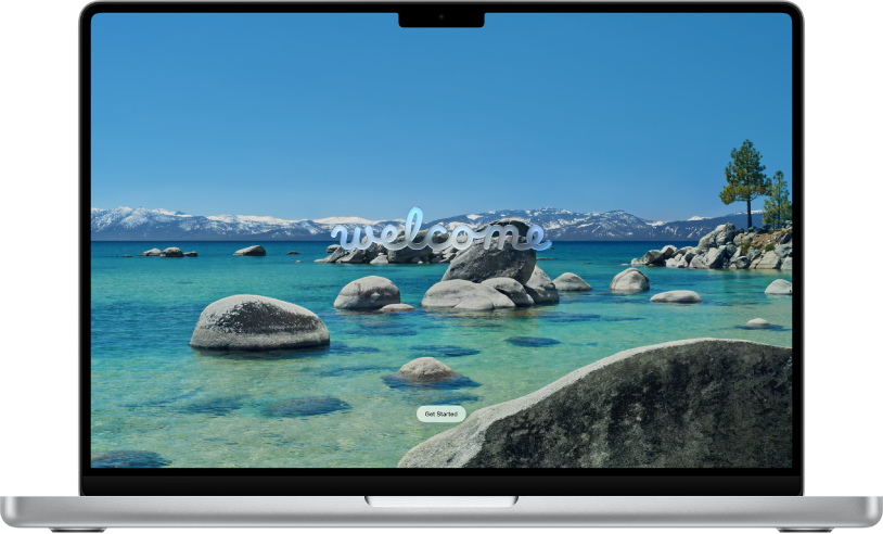 Na zaslonu Maca prikazana je slika radne površine s jezerom i planinama te poruka dobrodošlice za korisnike koji žele početi koristiti macOS Tahoe.