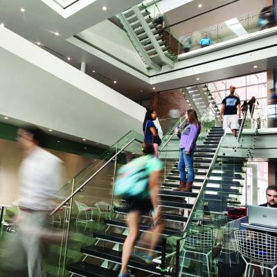 HHD Building lobby with student in motion blur.